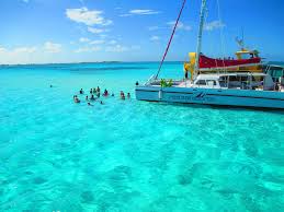 Cruise ships dock anchor and tender passengers to shore with there small lifeboats. Should The Cayman Islands New Cruise Port Facility Project Go Ahead