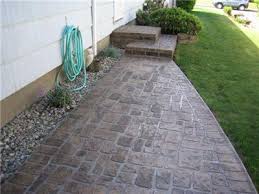 Stenciling concrete is an inexpensive way to add style to an otherwise utilitarian floor. Stenciled Concrete Walkways Driveways Patios