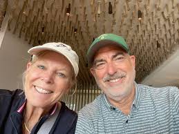 Scott Christensen (aka Chief Illiniwek, 1981-83) and wife Kathy (Class of  '84) finished up their morning round of golf in Newport, R.I., in time to  watch their alma mater take