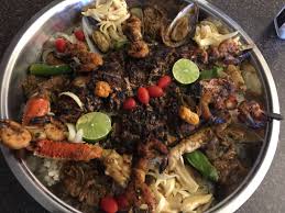 Plat Senegalais Called C Est Bon Grilled Red Snapper Mussels Crab Legs Shrimp And Scallops Over A Bed Of Ri Grilled Red Snapper African Food Onion Sauce