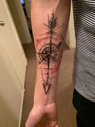 A popular way of combining these elements in a tattoo design is to have the two overlaid, with the compass midway along the length of the arrow. Compass And Arrow Done By Jared Rocker At Clovis Ink Clovis Ca Tattoos