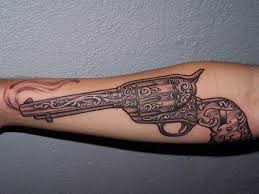 Skull put on the crossing of guns point and roses jointly done as her supreme chest piece. 15 Most Creative Gun Tattoo Designs With Pictures