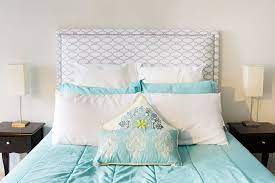 If you are going for a more plain bedding theme, you can add your splash of pattern on your headboard. Fabric Headboard Jennifer Meyering