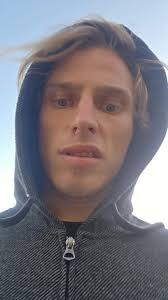 White Guy Who Raps with A Silver Jacket and Bandana