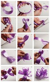Twist the tail of ribbon where your fingers are pinched so that the front side of the fabric is facing up. Diy How To Make A Ribbon Pom Pom Bow The Koch Blog Bows For Presents Bows Diy Ribbon How To Make A Ribbon Bow