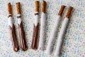 For their wedding favors, sarah's sister made more than 500 bride and groom chocolate dipped pretzels that she bagged and put a blush sticker that read s&k, 10.04.14. we had them placed on the table settings as people sat down—they were adorable and delicious! says sarah. Wedding Pretzel Party Favors Finger Food Ideas The Inspiration Edit