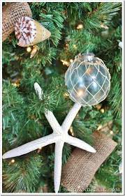 The perfect fit for your seaside christmas. Coastal Christmas Tree Sand And Sisal Coastal Christmas Coastal Christmas Tree Xmas Tree Decorations