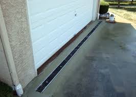 Many Homes Have Driveways That Slope Towards The Garage Or Home During Rainstorms Water Can Flow Onto Your Pr Drainage Solutions Yard Drainage Exterior Doors
