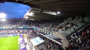 The team colors are white and purple. The Wycombe Wanderer Anderlecht Constant Vanden Stock Stadium