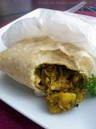Paratha Or Buss Up Shut Roti Chicken Roti Recipe Jamaican Roti Recipe Roti Recipe Guyanese
