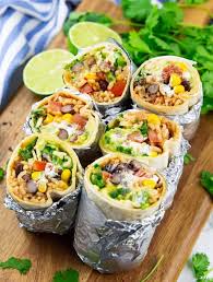 This Vegan Burrito Is Stuffed With Brown Rice Black Beans Corn Vegan Sour Cream And Guacamole V Vegan Lunch Recipes Vegan Burrito Tasty Vegetarian Recipes