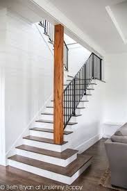 Stairs To The Basement Open Staircase Wood Planked Walls Stained And Painted Stairs Metal Rai Beach House Floor Plans Basement Remodeling Basement Staircase