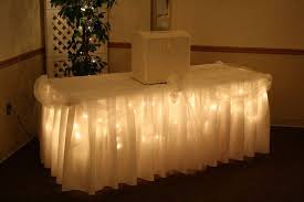 Icicle Lights Under Table Cloth And Tulle Accents With Bows We Could Use Turquoise Tulle An Wedding Reception Decorations Wedding Lights Tulle Decorations
