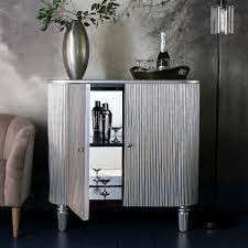 Reliable beverage refrigerators keep your beverages at optimum temperature, provide an aesthetic appearance, have viewing windows that act as doors, and keep drinks cool. Jeeves Silver Drinks Cabinet Costco Uk