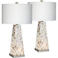 It fits perfectly on my bedside table and gives off a beautiful golden glow because the inside of the lamp shade is lined with. Amsdaexfrmo0om