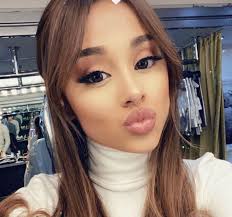 This look is all about the spring. Ariana Grande Debuted 70s Inspired Curtain Bangs On Instagram