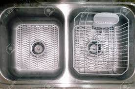Household kitchen sink faucet drainer sponge cloth draining storage rack shelf o. Double Bowl Kitchen Sink With White Mats And Dish Drainer Stock Photo Picture And Royalty Free Image Image 11309343