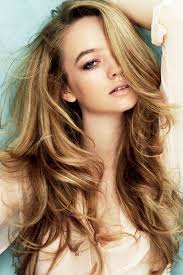 Beautiful model with long smooth, flying blonde hair isolated on white studio background. 24 Hair Color Ideas That Will Make You Want To Go Blonde