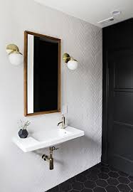 From Hexagon And Honeycomb To Herringbone And Fish Scale These Statement Geometric Tiles Have A Bathroom Inspiration Bathroom Interior White Herringbone Tile