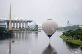 Putrajaya hot air balloon ride. Putrajaya Malaysia 31 March 2019 The Beautiful Of Multi Shaped Of Hot Air Balloons Floating Over Sunrise Skies At The 10th Putrajaya International Hot Air Balloon Fiesta 2019 Stock Photo Picture