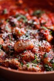 Divide the meat mixture into 24 equal sized meatballs and place on the foil lined baking sheet, at least an inch apart. Easy Pork Sausage Meatballs In Tomato Sauce Simply Delicious