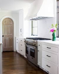 Natural Wood Pantry Door In White Kitchen Home Kitchens Kitchen Remodel Kitchen Design