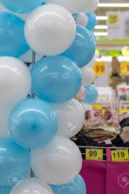 Easy fancy party decoration from dollar store balloons. Close Up Of A Bunch Of White And Blue Balloons Hanging From A Steel Bar Near A Department Store Lingerie Stock Photo Picture And Royalty Free Image Image 108294656
