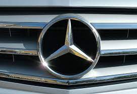Mercedes metallic logo closeup on mercedes car displayed at moto show in cracow poland. Mercedes Benz Logo Evolution Logo Design Love