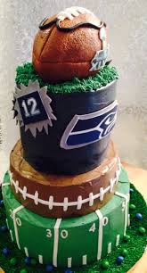 Seahawks Super Bowl Xlviii Cake Top And Bottom Tiers Are Blue And Green Layers Of Cake With A Skittles Buttercream F Seahawks Super Bowl Super Bowl Xlviii Cake