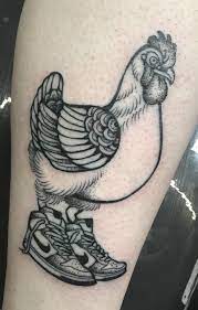 Just A Chicken Wearing Nikes By Stephany Manca Showdown Tattoo In Edmonton Ab In 2021 Chicken Tattoo Tattoos Traditional Mermaid Tattoos