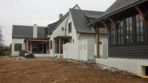 Black And White Brick House Shingled English Modern Home Back Yard Details Black Siding White Washed Brick White Brick Patio Brick Farmhouse Brick Exterior House White Brick Houses