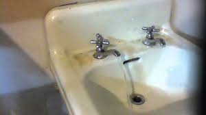 vintage split faucet sink installed in