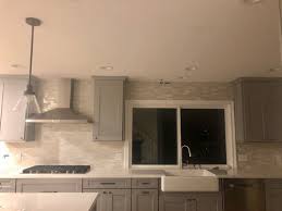 Either 4 or 6 high or from the countertop to the bottom of the cabinets. Uneven Ceiling Backsplash