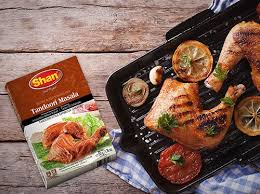 Add salt, sugar, and crushed tomatoes; Chicken Tikka Shan Foods