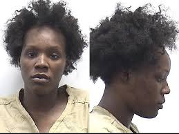 Athens woman arrested after trying to stab man and woman, spit