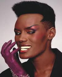 African American Black Woman 80s Black Hairstyles Singer Actress And Model Grace Jones Is Beloved For Her Outlandish Style Wild Personality And Her Grace Jones African American Hairstyles Interesting Faces