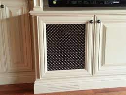 Make a sturdy cabinet from a sheet of plywood, then make a chicken wire door. Another Mesh Option For Cabinet Doors Entertainment Center Traditional Home Speaker Mesh Design Traditional House Built In Entertainment Center Cabinet Doors