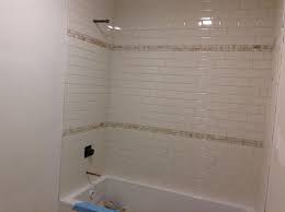 Shower Tile Is Up No Grout Yet And No Bullnose Pieces On The Edge Because They Ran Out Shower Remodel Small Shower Remodel Shower Remodel Diy