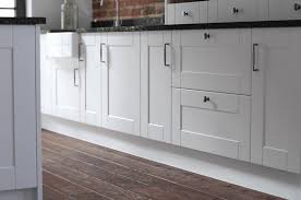 Grey kitchen walls with white cabinets and dark flooring options. Kitchen Colour Schemes For Dark Wooden Floors Wren Kitchens