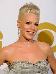 The hair is styled into loose spikes with frizzy ends that make this haircut a hybrid between a more classic spiky cut and a brushed up style. Pink Hairstyle Popular Haircuts