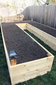 Finish your diy raised garden bed by moving it into the desired location in your yard and filling it with a growing medium of your choosing. Building A Raised Garden Bed Projectgrowourownfood Via My Daily Randomness Building A Raised Garden Raised Garden Garden Beds