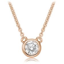 This pretty pendant is crafted of smooth 10 karat rose gold and heart is outlined in small white round diamonds. Necklace For Woman 10k Rose Gold Solitaire Diamond Color Pink Doucet Latendresse