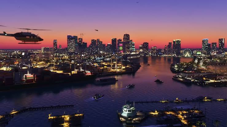 Visão panorâmica de Vice City no GTA 6 com letreiros em neon e praia