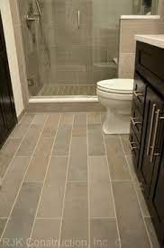 On the walls are white rustic metro tiles 15 x 7.5cm, £39.95 per m2, both are available at walls and floors. Master Bath Bathroom Tile Floor Ideas Bathroom Plank Tile Flooring Design Ideas Pictures Rem Plank Tile Flooring Bathrooms Remodel Small Bathroom Remodel