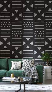 Dark Walls Done Right This Pared Down Wallpaper Design Features A Simple Monochrome Palette Wit African Interior Design Wallpaper House Design Interior Design