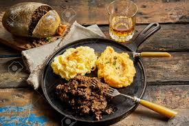To mark the occasion, there is a hearty feast on offer which is made up of haggis, neeps and tatties and copious amounts of whisky. Rustic Meal Of Haggis Neeps And Tatties Served With A Tumbler Stock Photo Picture And Royalty Free Image Image 75988927