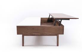 At first a compact table, this wood and white lacquer find can stretch its top 360 degrees. Furniture Maison Modern Walnut Lift Top Coffee Table