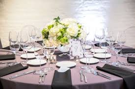 Modern dining table with tropical centerpiece and mismatched chairs. Wedding Centerpiece Ideas Chez Chicago Wedding Venue