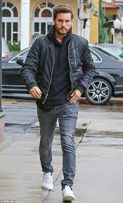 Scott Disick Wearing Black Bomber Jacket Black Hoodie Grey Jeans White Low Top Sneakers Black Bomber Jacket Mens Outfits White Jeans Men