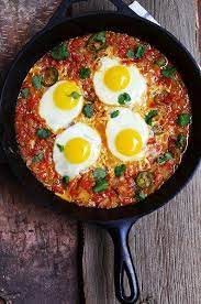 Shakshuka Cradle Your Eggs In A Cozy Blanket Of Tomatoes And Spices Shakshuka Recipes Recipes Shakshuka
